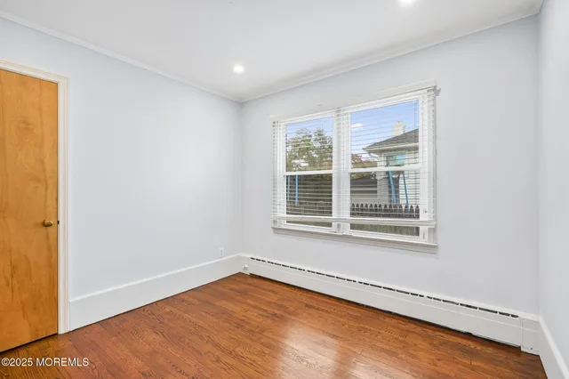 a view of empty room with wooden ceiling