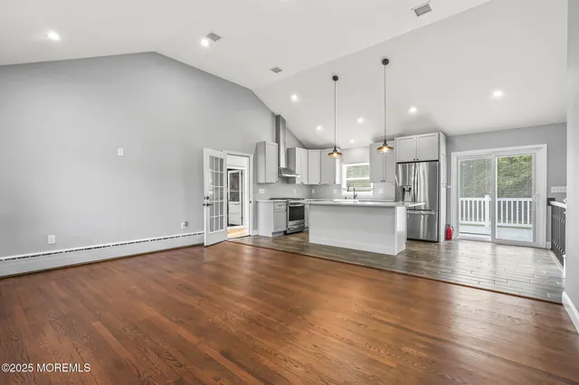 a living room with fireplace furniture and a flat screen tv