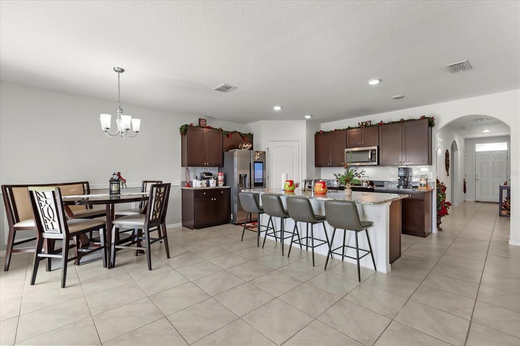 201 Wood Hollow Road DeLand, FL 32724 - Photo 13 of 32 a view of a dining room kitchen and a window