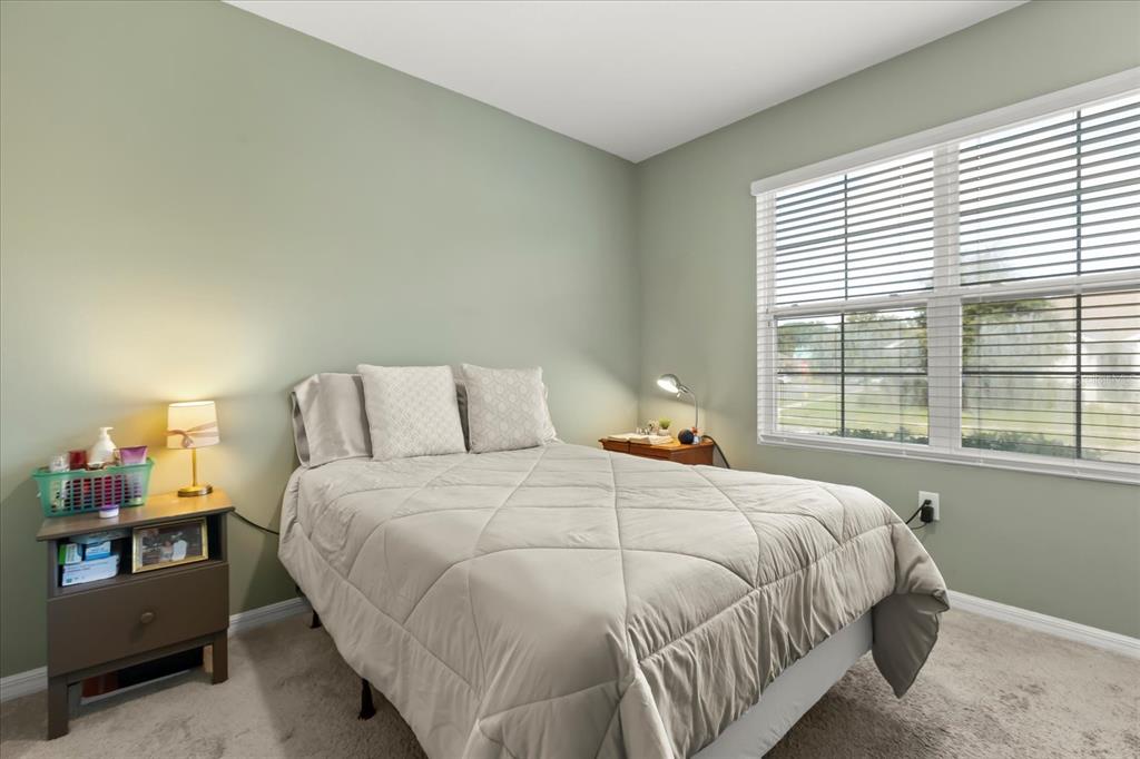 201 Wood Hollow Road DeLand, FL 32724 - Photo 14 of 32 a bedroom with a bed and window