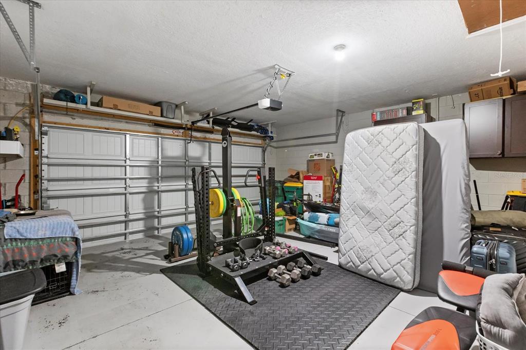 201 Wood Hollow Road DeLand, FL 32724 - Photo 29 of 32 a storage room with furniture a rug and other equipment