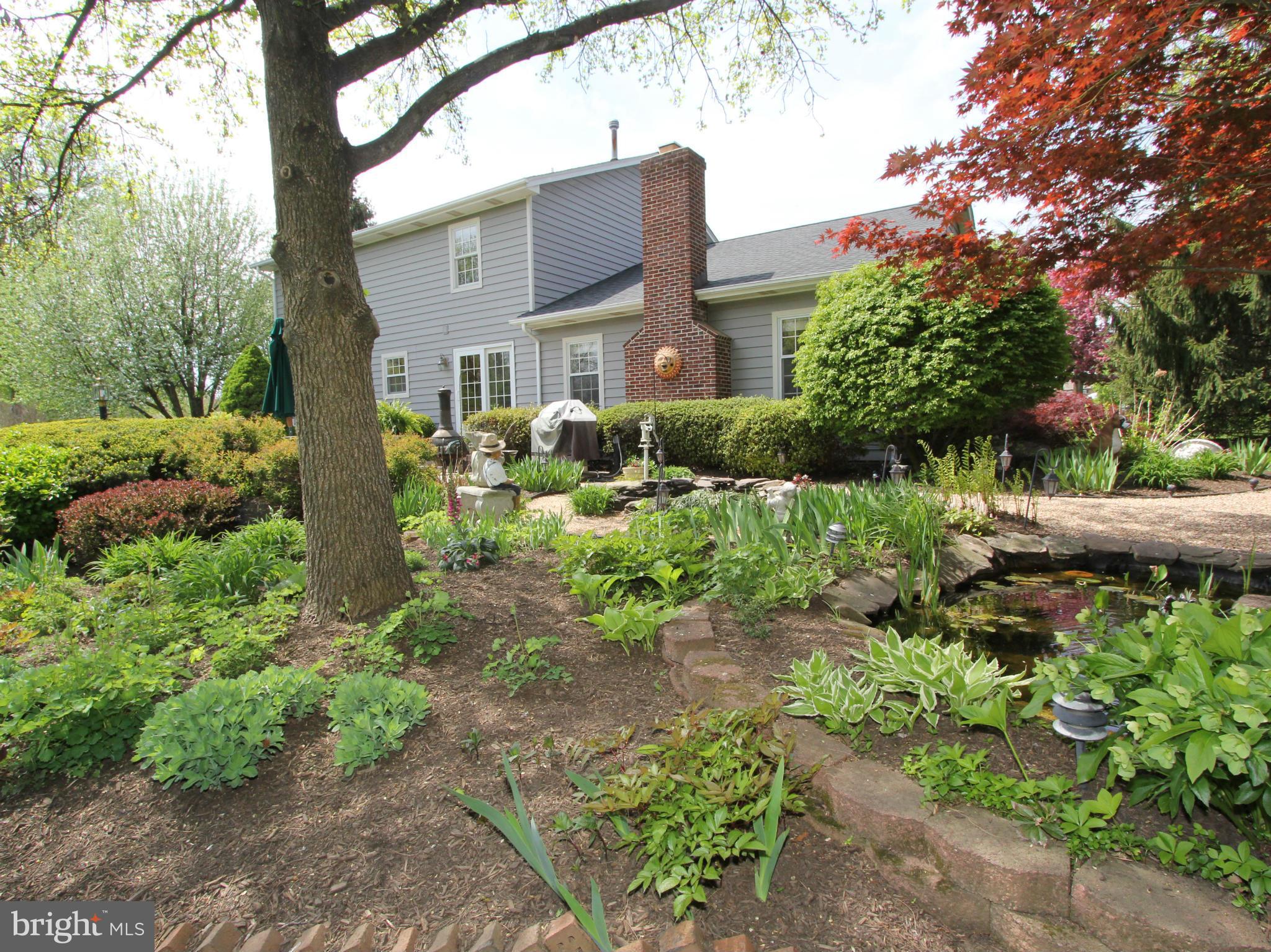 6700 Stone Ridge Court Frederick, MD 21702 - Photo 22 of 30 a front view of a house with a yard