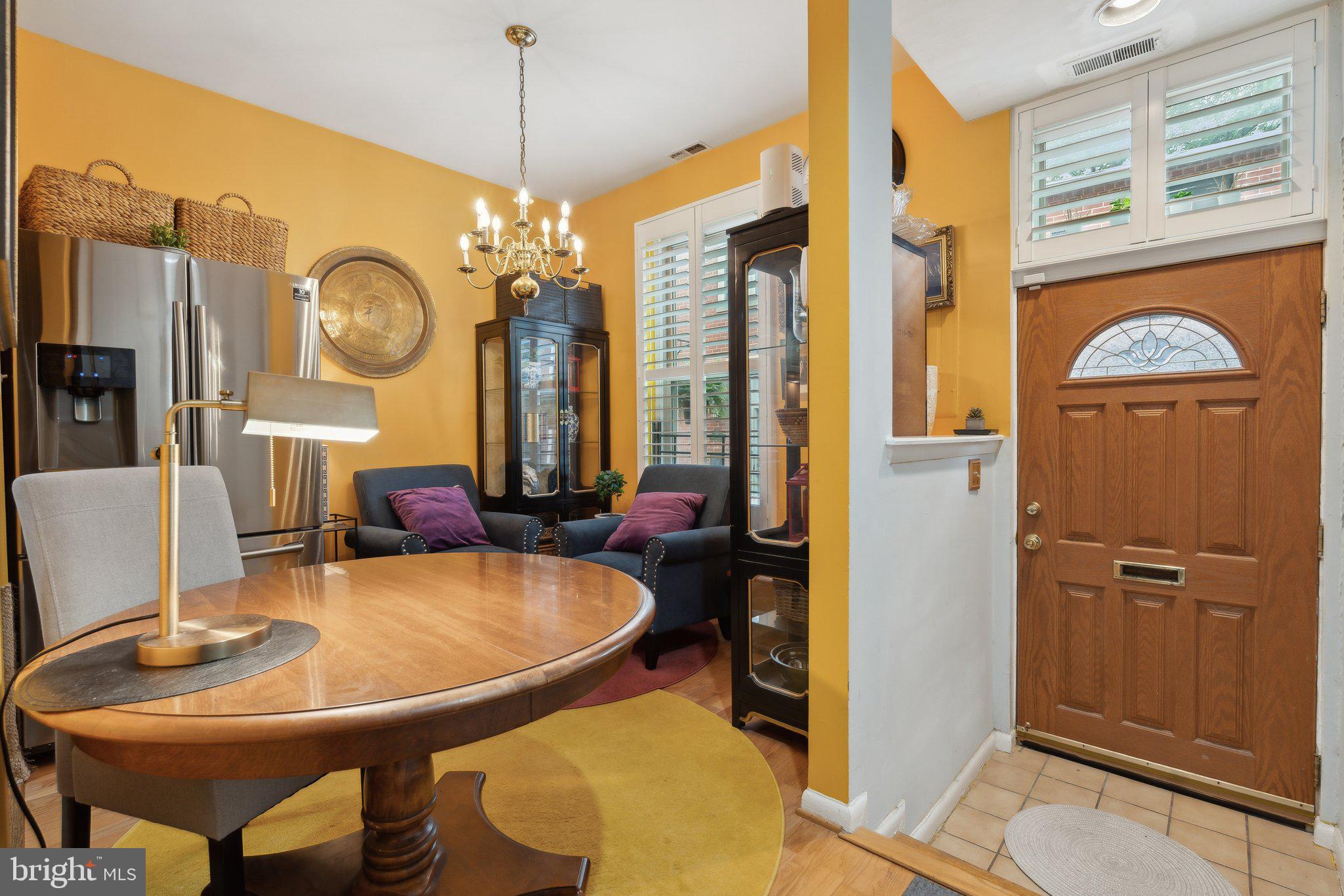 623 Jasper Street Baltimore, MD 21201 - Photo 11 of 32 a view of a dining room with furniture and a chandelier