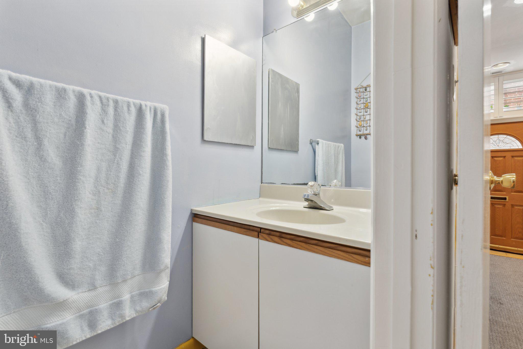 623 Jasper Street Baltimore, MD 21201 - Photo 12 of 32 a bathroom with a sink and a mirror