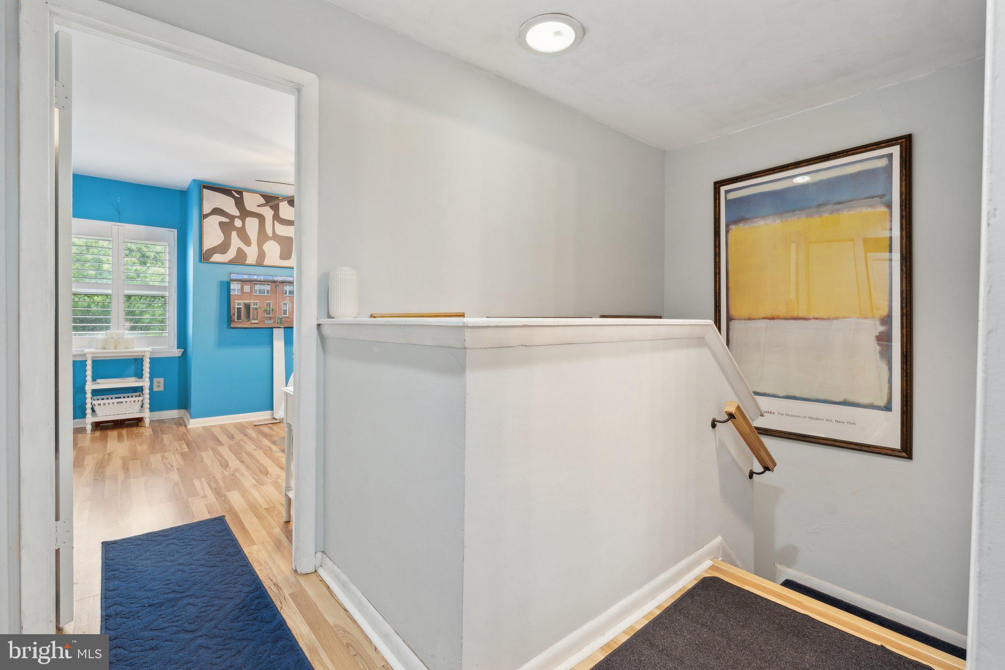 623 Jasper Street Baltimore, MD 21201 - Photo 13 of 32 a view of an empty room with wooden floor and a window