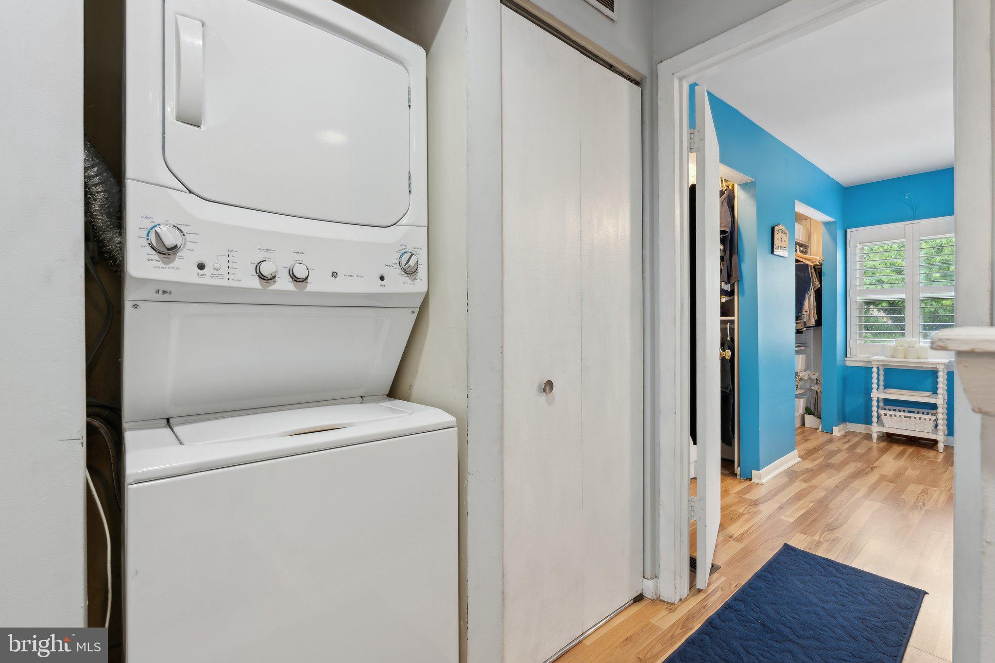 623 Jasper Street Baltimore, MD 21201 - Photo 15 of 32 a view of washer and dryer with wooden floor