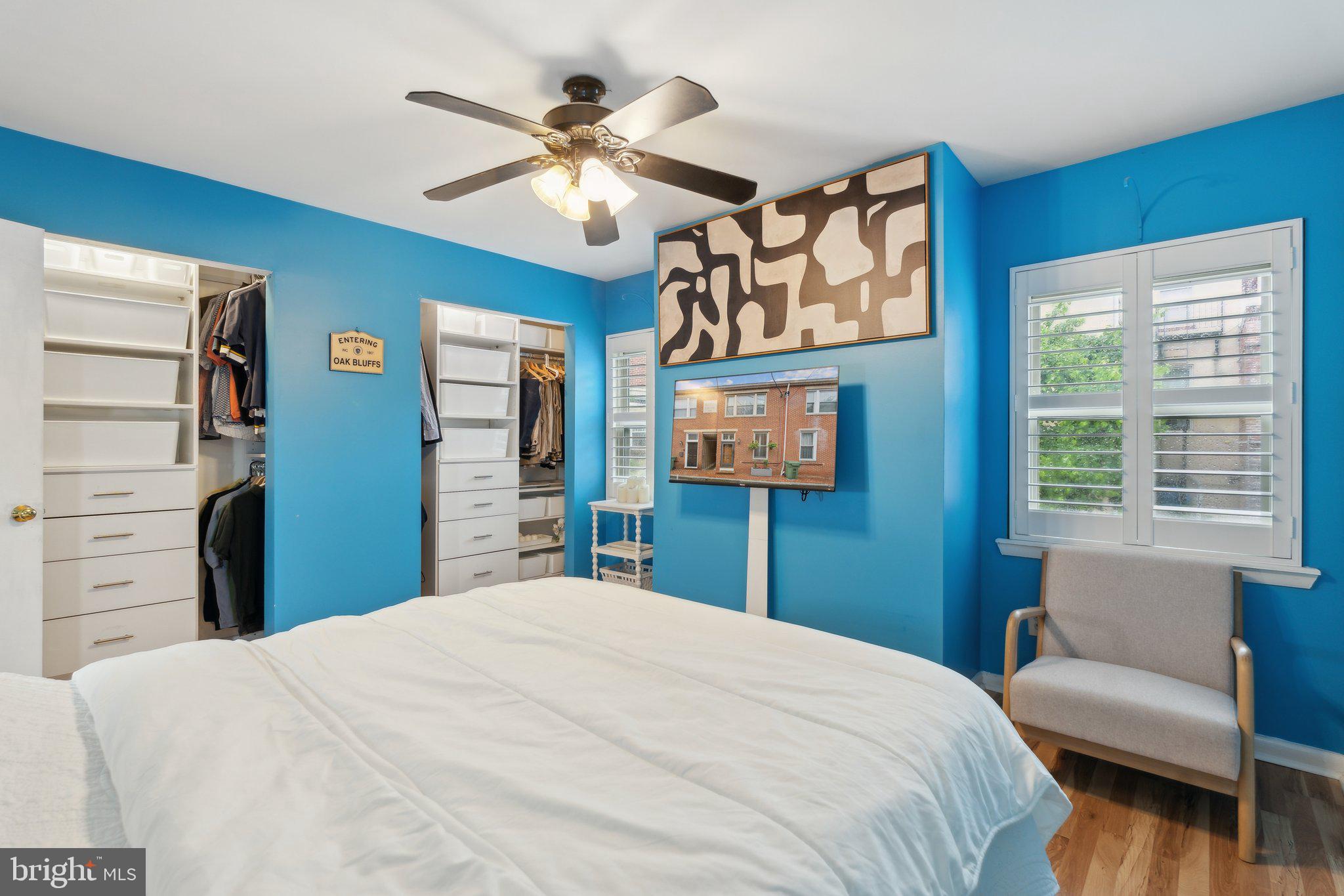 623 Jasper Street Baltimore, MD 21201 - Photo 19 of 32 a bedroom with a bed and a chandelier