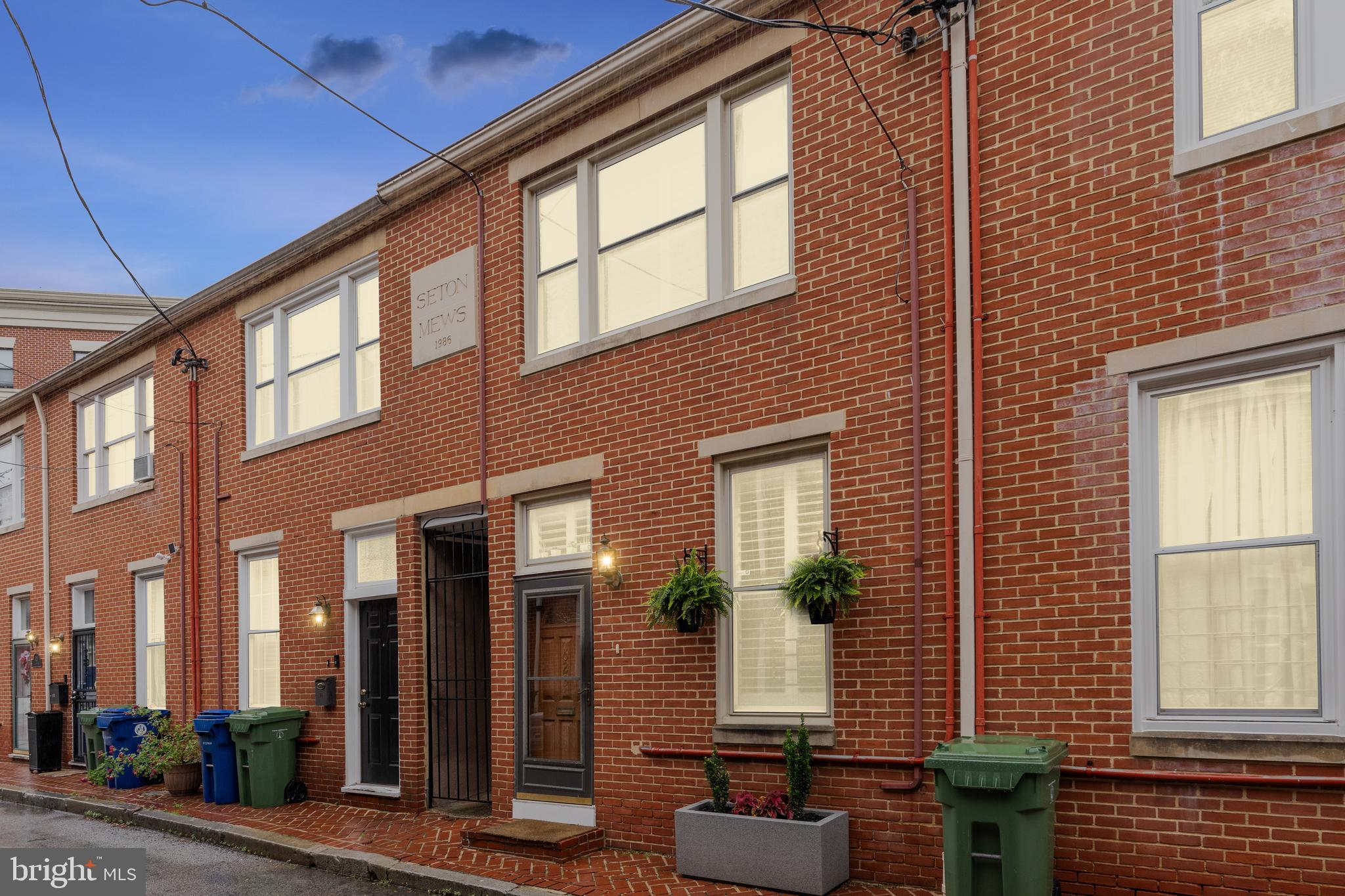 623 Jasper Street Baltimore, MD 21201 - Photo 2 of 32 a front view of a house with a garden
