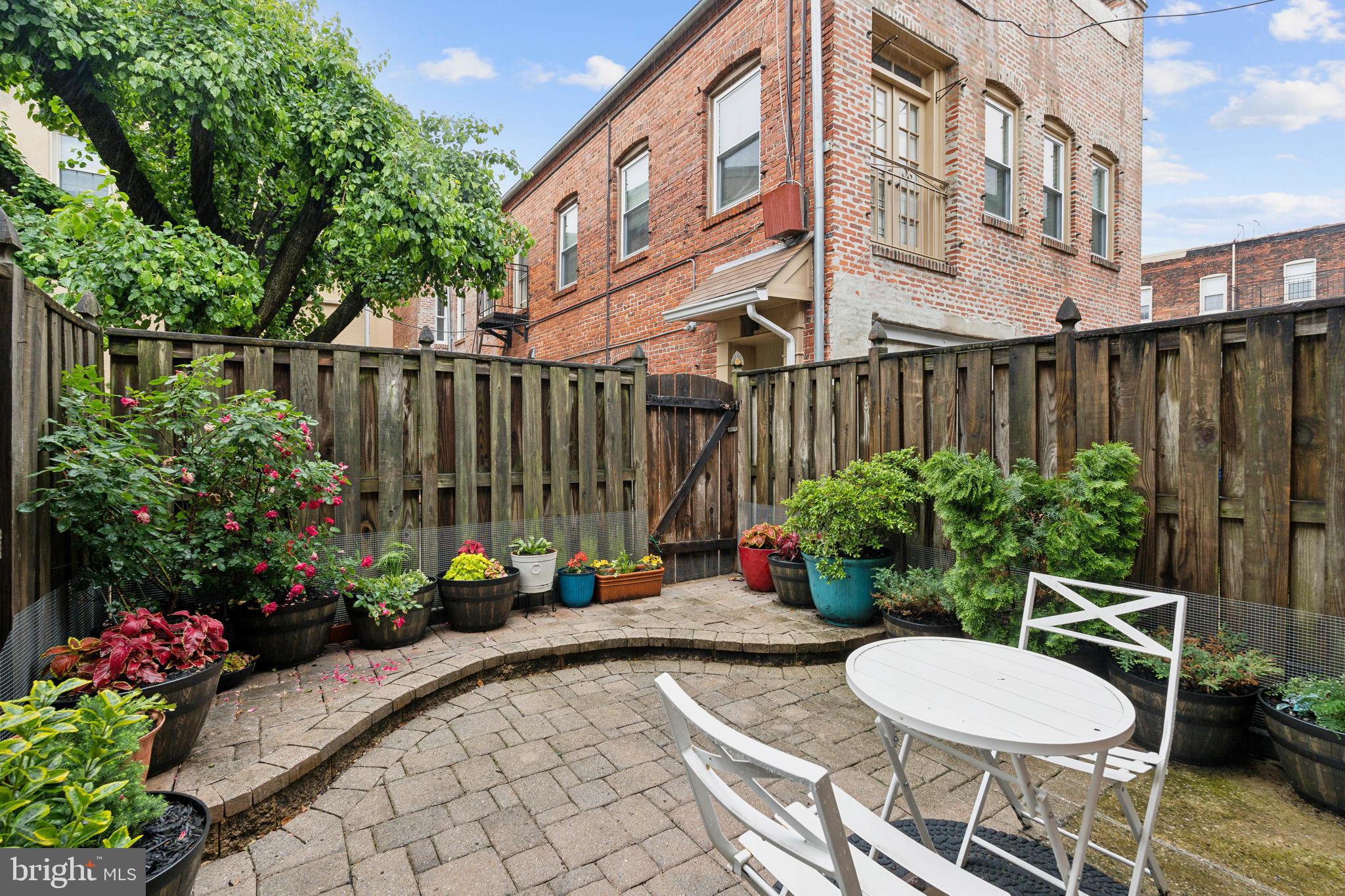 623 Jasper Street Baltimore, MD 21201 - Photo 25 of 32 a view of a chair and table in backyard