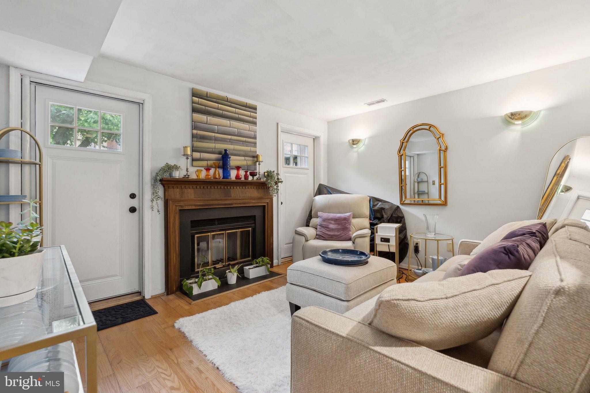 623 Jasper Street Baltimore, MD 21201 - Photo 5 of 32 a living room with furniture and a fireplace