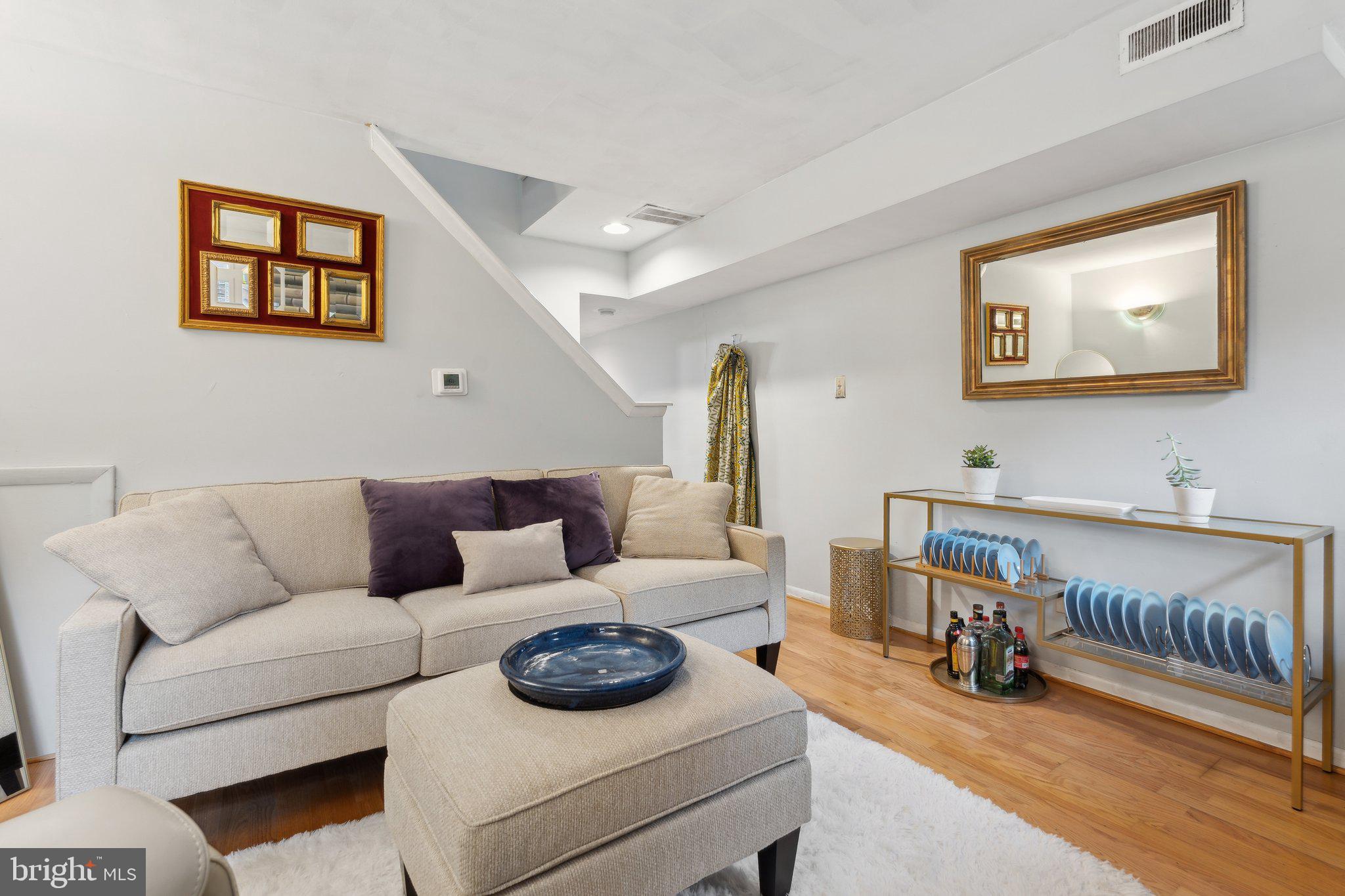 623 Jasper Street Baltimore, MD 21201 - Photo 6 of 32 a living room with furniture and a wooden floor