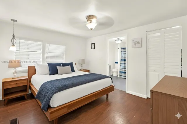 a bathroom with a shower curtain and a window