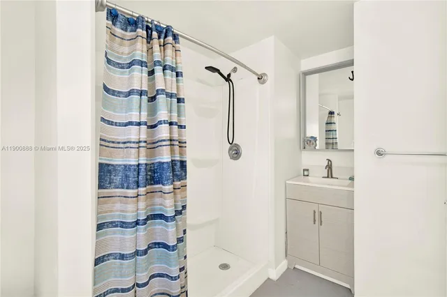 a bedroom with bed and window