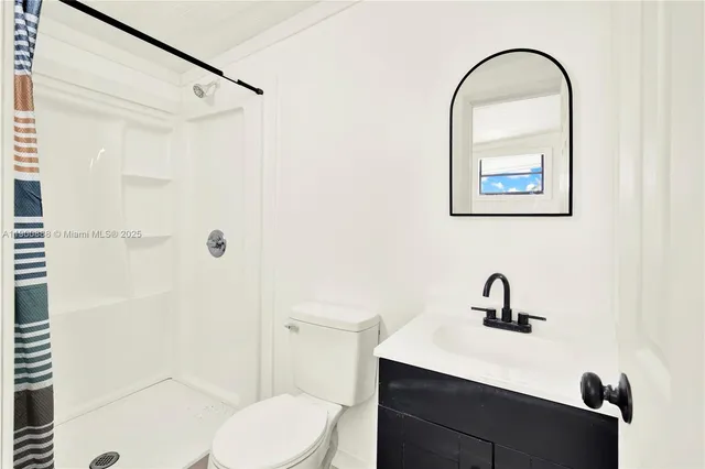a view of kitchen with stainless steel appliances granite countertop a refrigerator and a stove