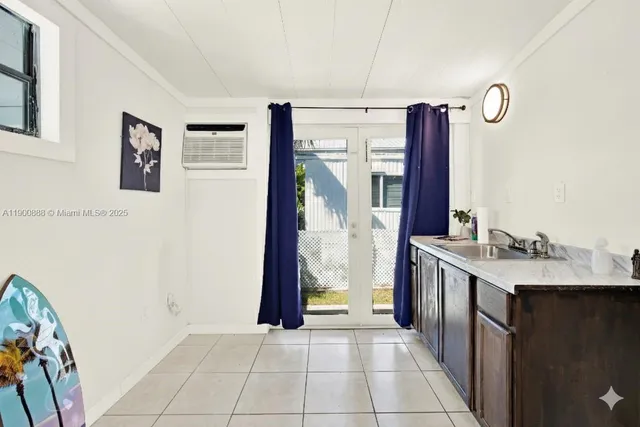 a view of a chairs and table in the balcony