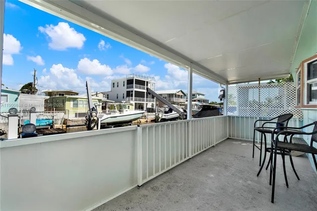 a view of swimming pool with seating space