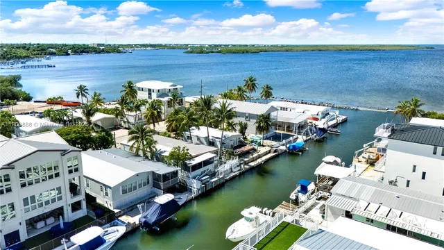 an aerial view of a house with a ocean view