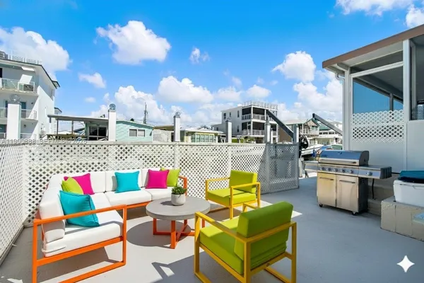 a terrace of a house with outdoor seating