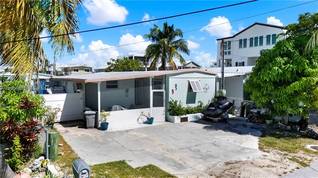 a view of a backyard with a patio