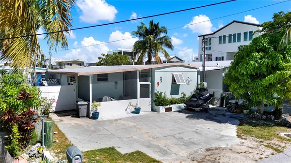a view of a backyard with a patio