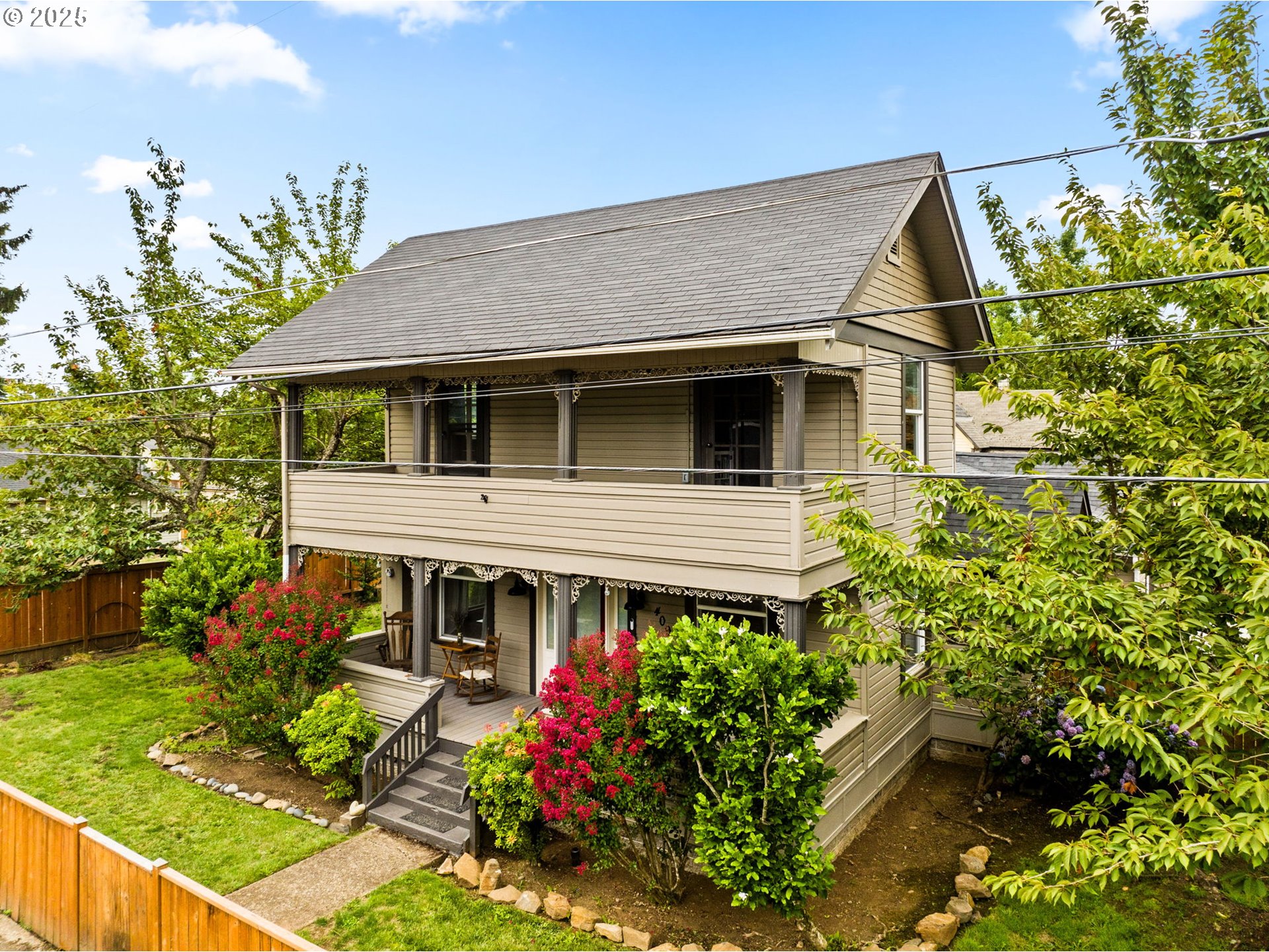 a house with lots of trees in the background