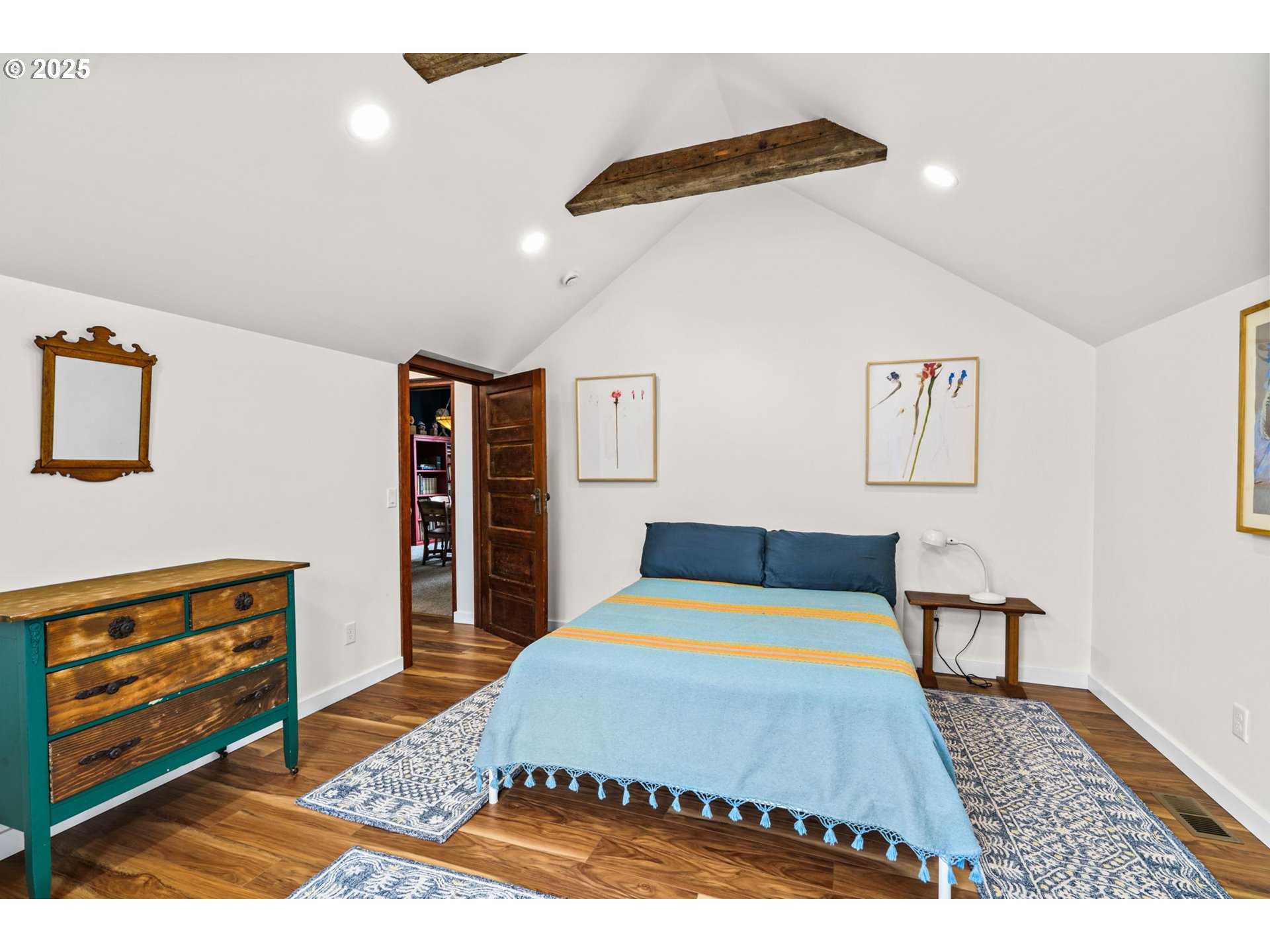 409 North 8th Street Cottage Grove, OR 97424 - Photo 16 of 48 a bedroom with a bed dresser and a dining table