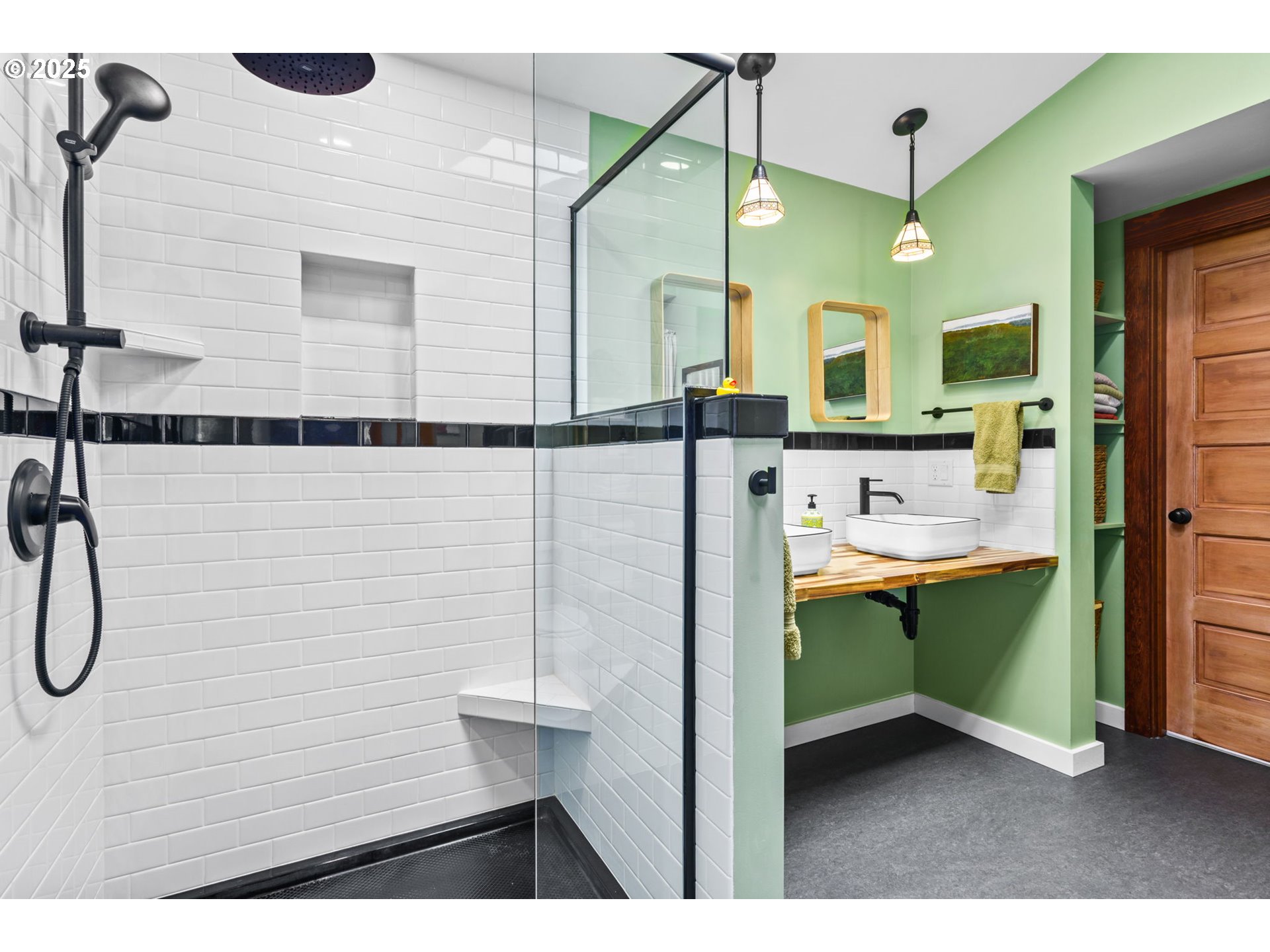 409 North 8th Street Cottage Grove, OR 97424 - Photo 17 of 48 a bathroom with a sink a mirror and a shower