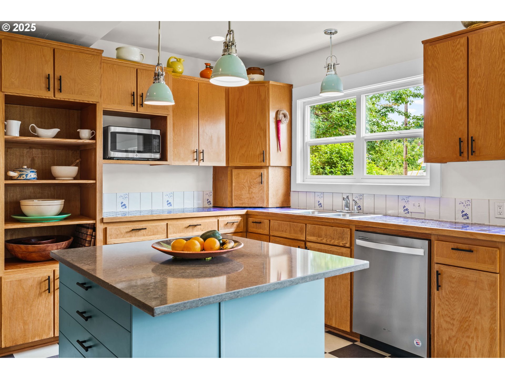 409 North 8th Street Cottage Grove, OR 97424 - Photo 21 of 48 a kitchen with a sink a stove and a window