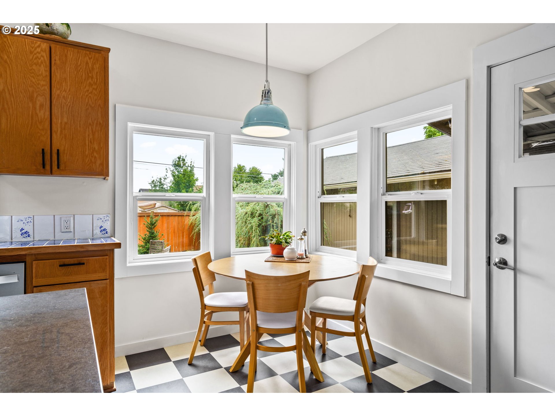 409 North 8th Street Cottage Grove, OR 97424 - Photo 22 of 48 a dining room with furniture a chandelier and wooden floor