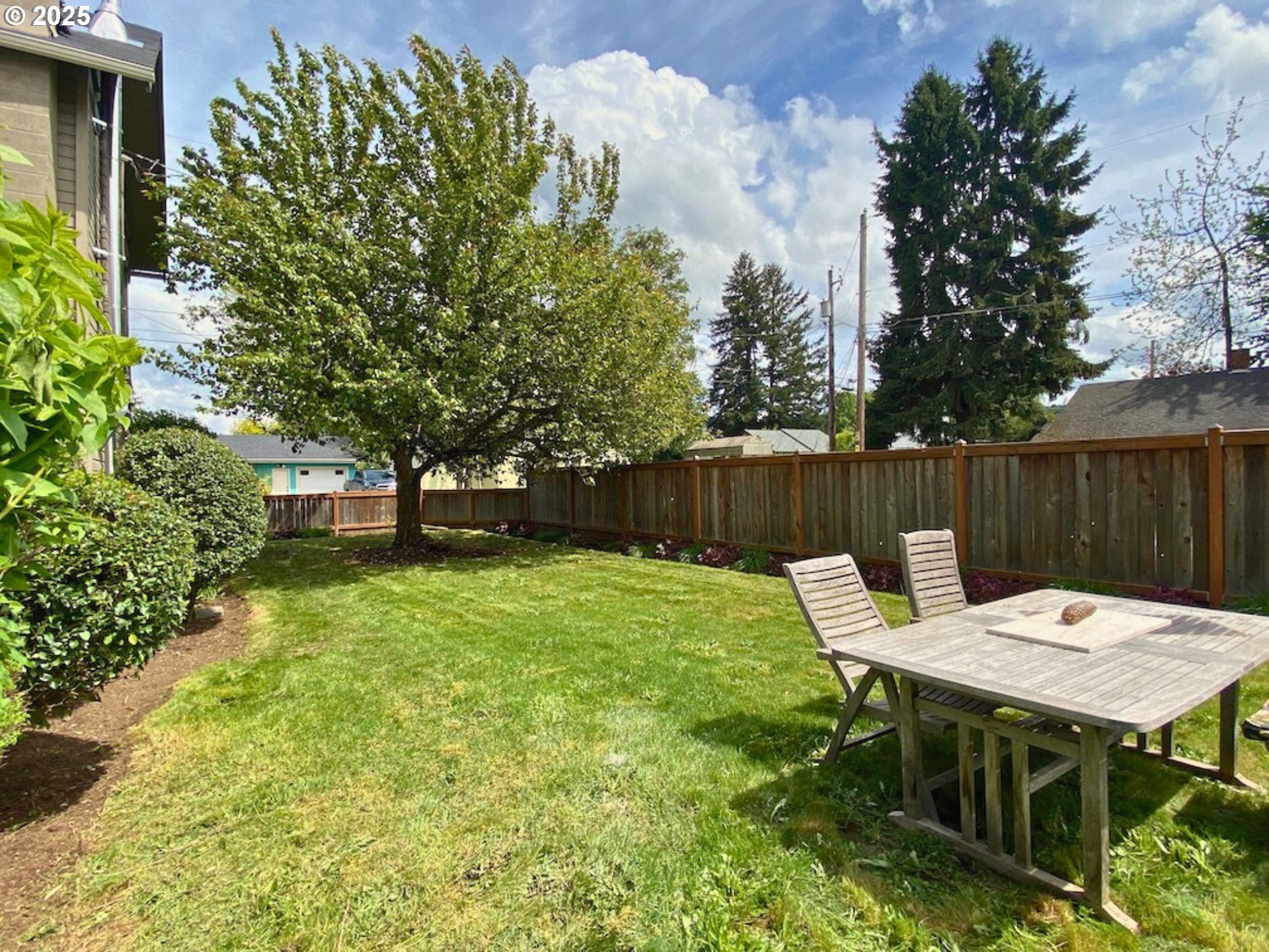 409 North 8th Street Cottage Grove, OR 97424 - Photo 41 of 48 a view of a table and chairs in the garden
