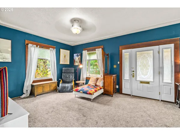 a view of a dining room with furniture window and outside view