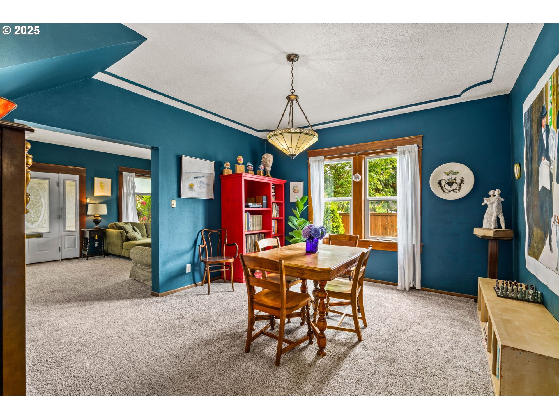 409 North 8th Street Cottage Grove, OR 97424 - Photo 10 of 48 a dining room with furniture a chandelier and window
