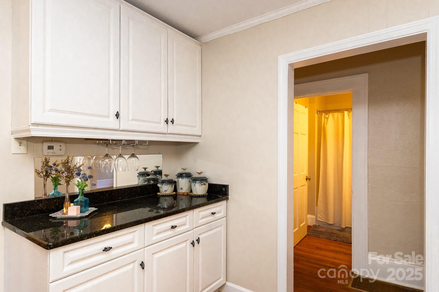 87 Pershing Road Asheville, NC 28805 - Photo 12 of 48 a kitchen with stainless steel appliances granite countertop a sink and cabinets