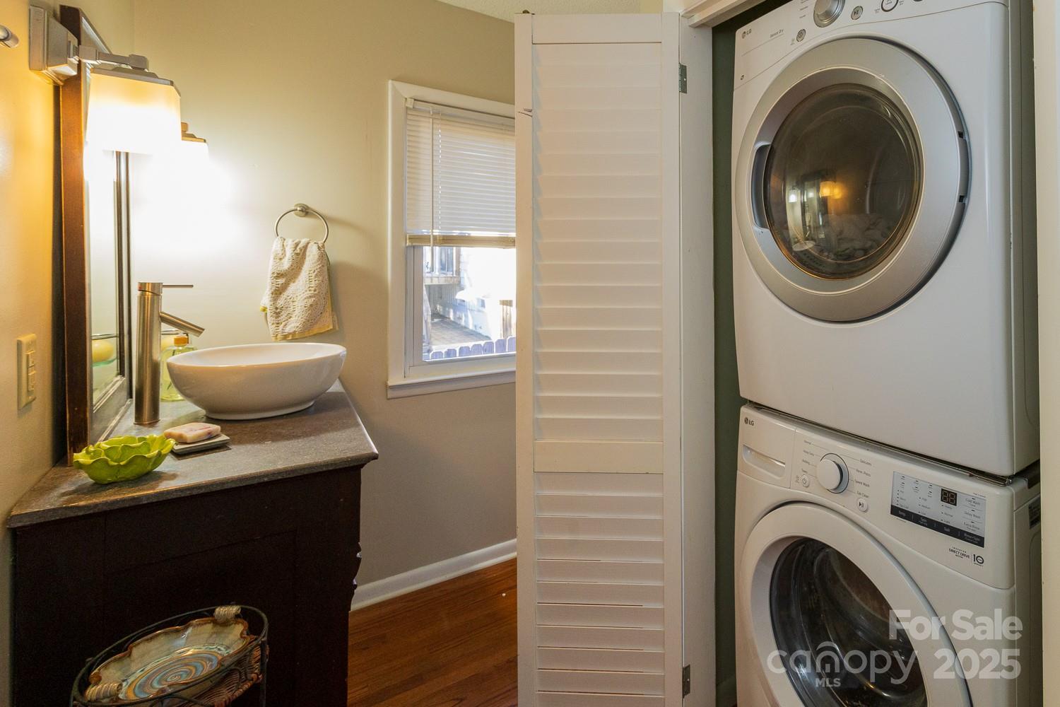 87 Pershing Road Asheville, NC 28805 - Photo 18 of 48 a view of a bedroom with washer and dryer