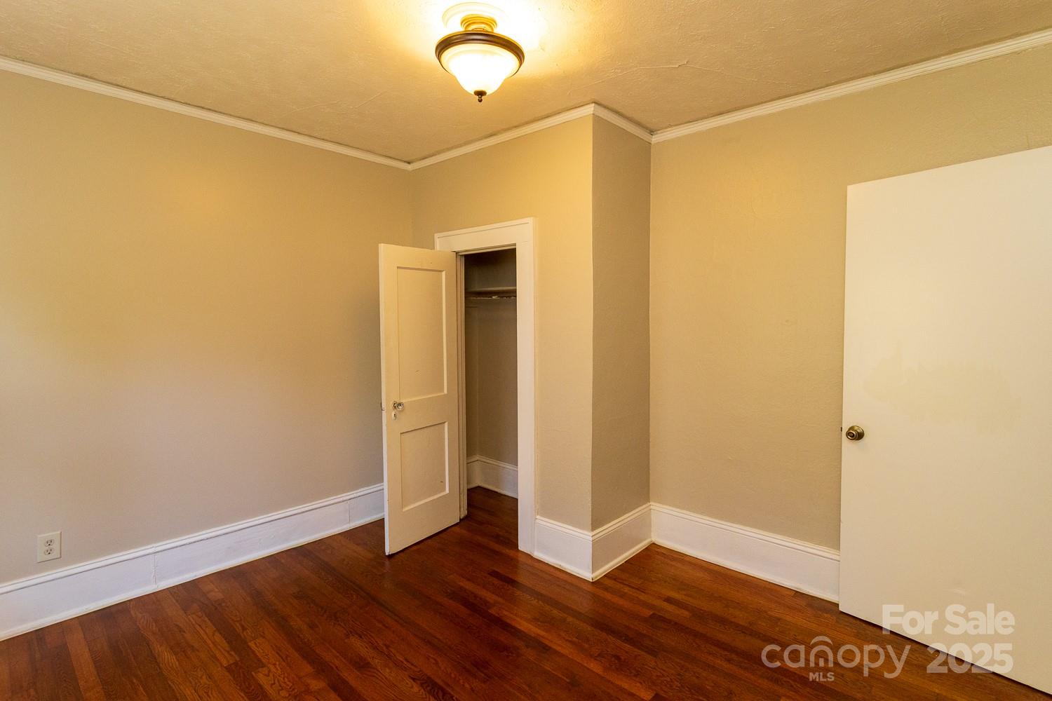 87 Pershing Road Asheville, NC 28805 - Photo 22 of 48 a view of a room with wooden floor