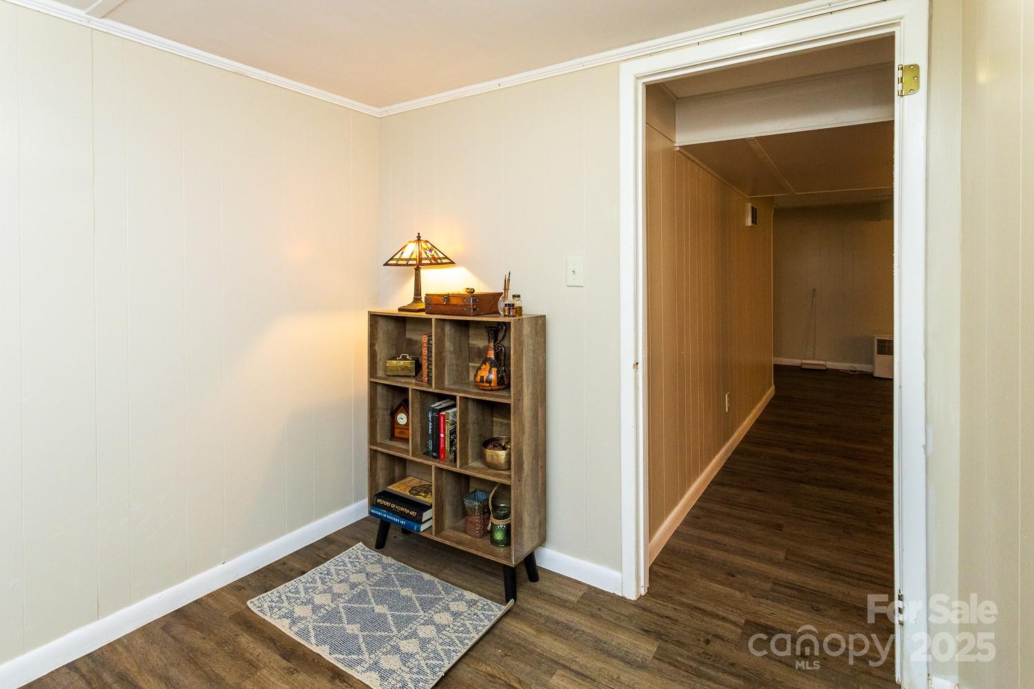 87 Pershing Road Asheville, NC 28805 - Photo 24 of 48 a view of a hallway with wooden floor and entryway