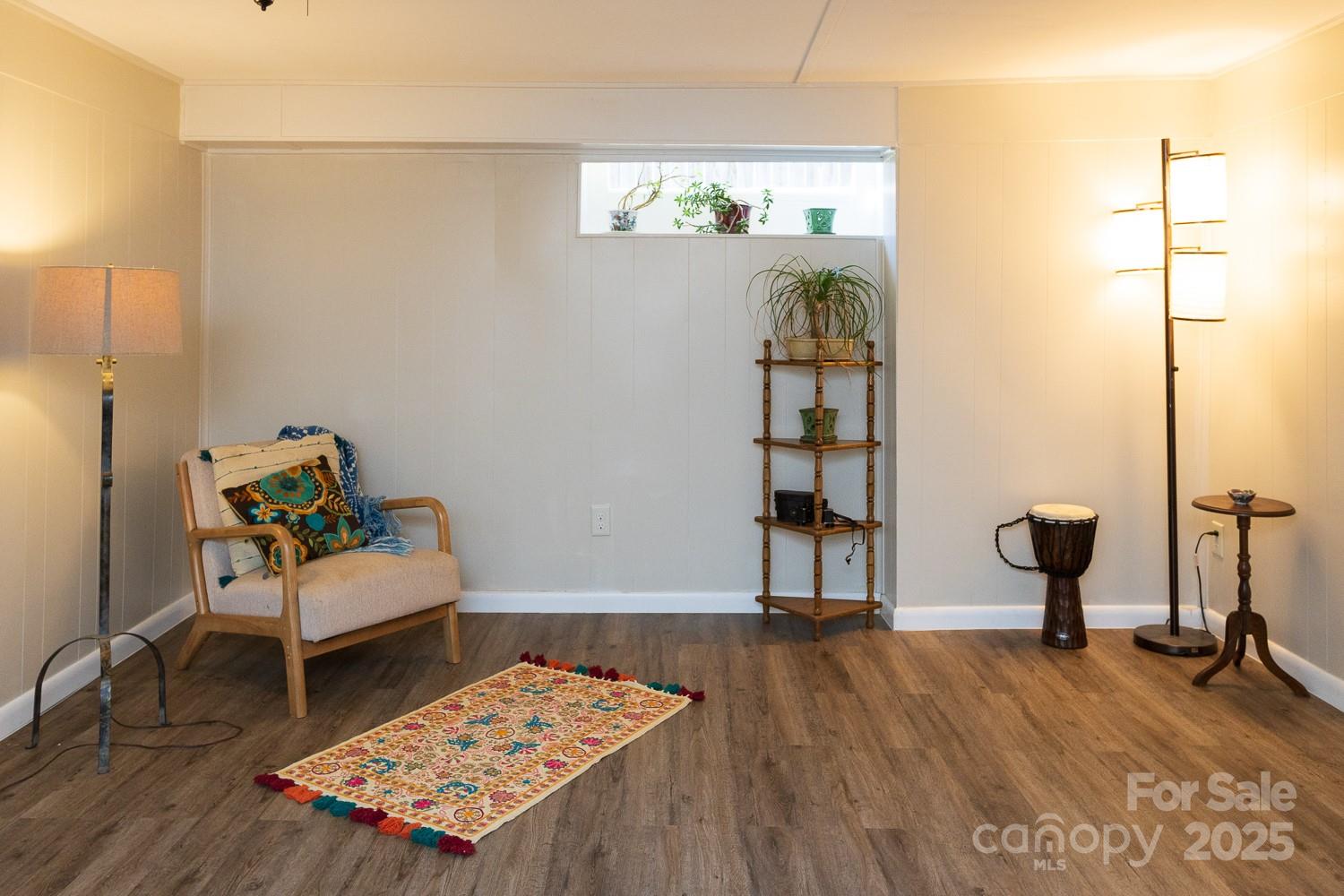 87 Pershing Road Asheville, NC 28805 - Photo 25 of 48 a living room with furniture and wooden floor