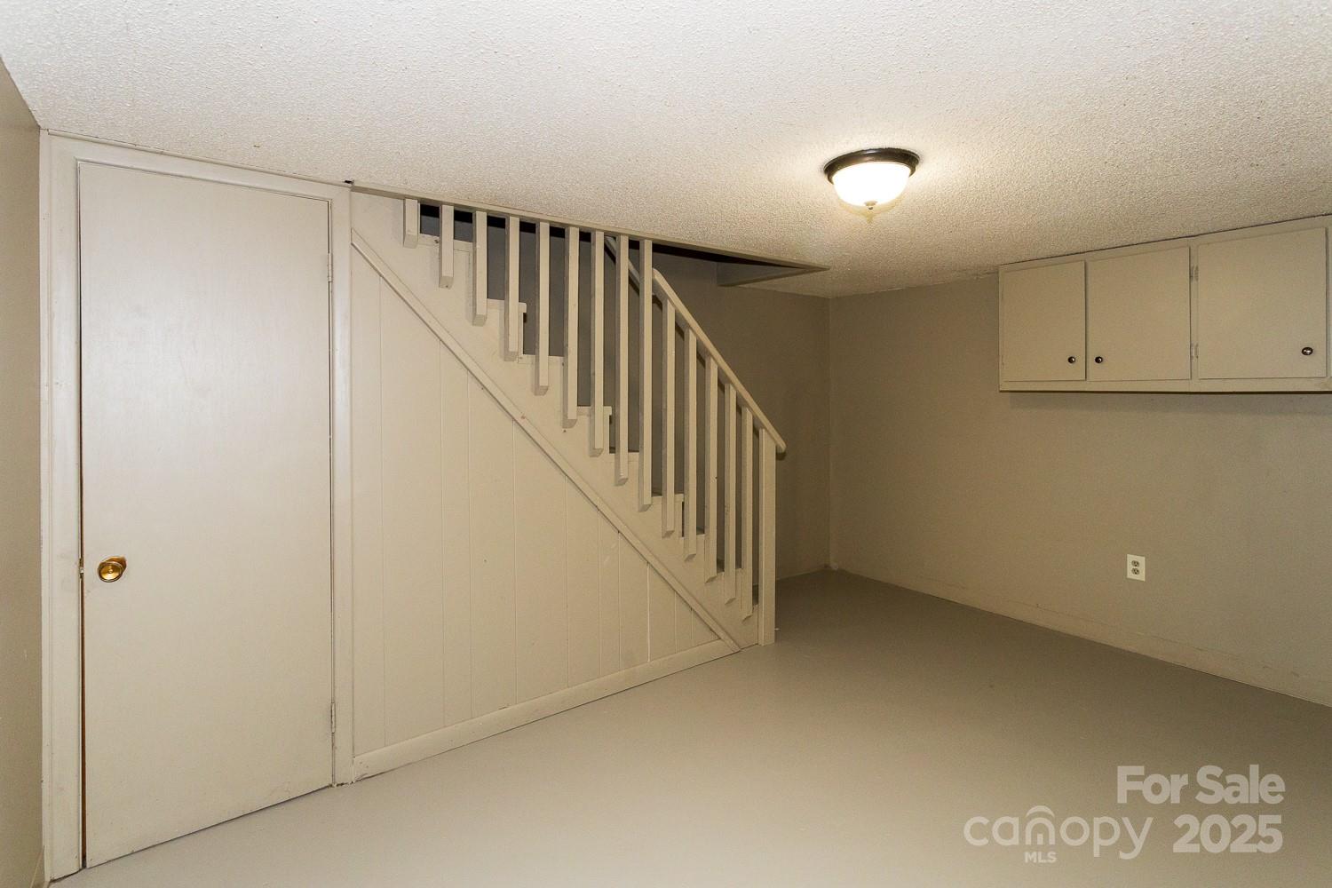 87 Pershing Road Asheville, NC 28805 - Photo 31 of 48 a view of hallway with stairs