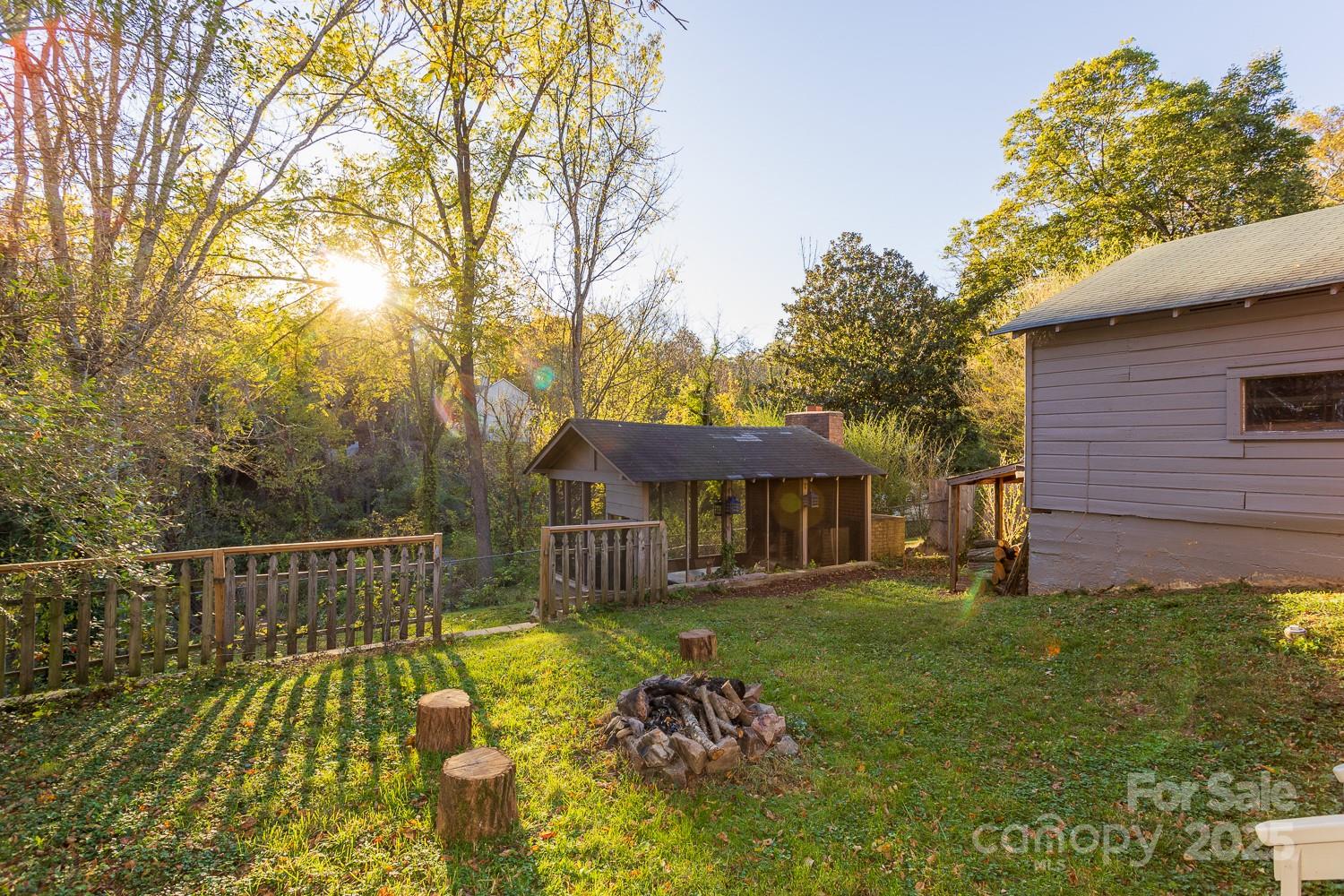 87 Pershing Road Asheville, NC 28805 - Photo 32 of 48 a front view of a house with garden