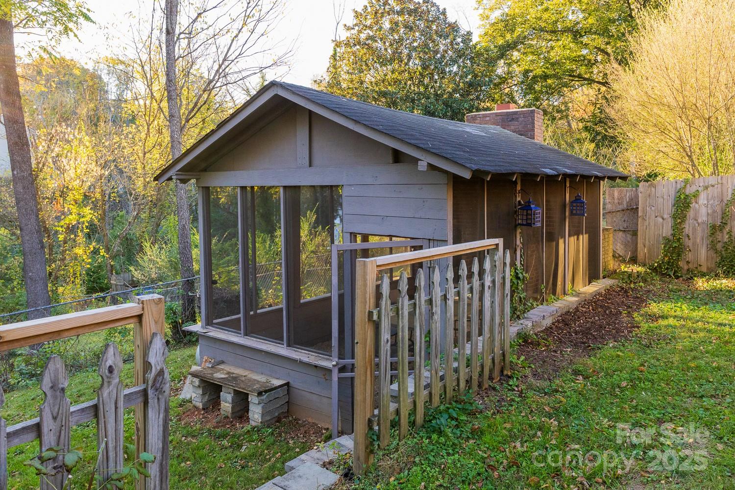87 Pershing Road Asheville, NC 28805 - Photo 35 of 48 a house with trees in the background