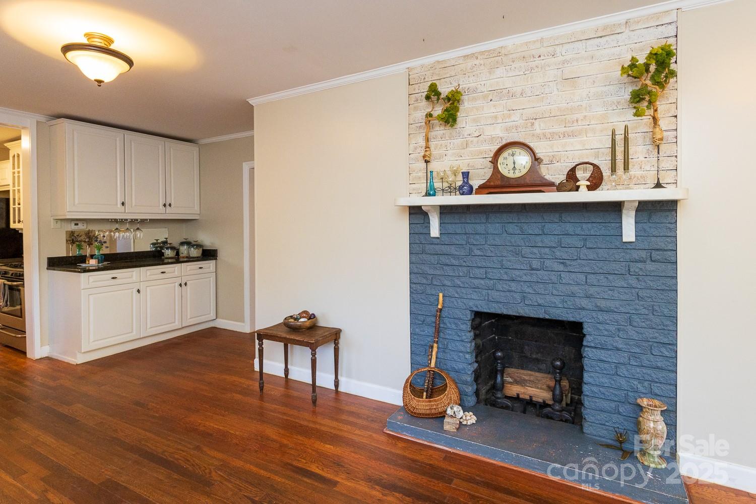 87 Pershing Road Asheville, NC 28805 - Photo 7 of 48 a kitchen with stainless steel appliances granite countertop a stove and a wooden floors