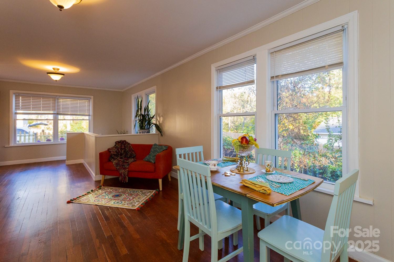 87 Pershing Road Asheville, NC 28805 - Photo 9 of 48 a view of a dining room with furniture window and wooden floor