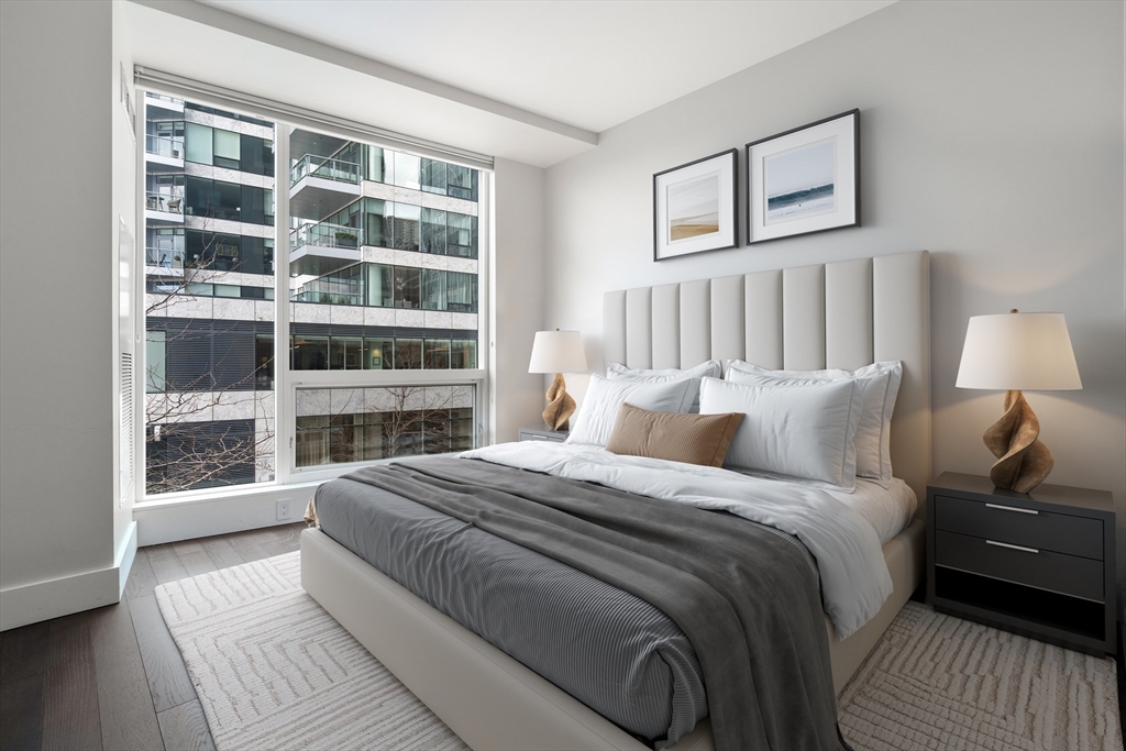 22 Liberty Drive, Unit 2F Boston, MA 02210 - Photo 17 of 28 a bedroom with a bed and a window