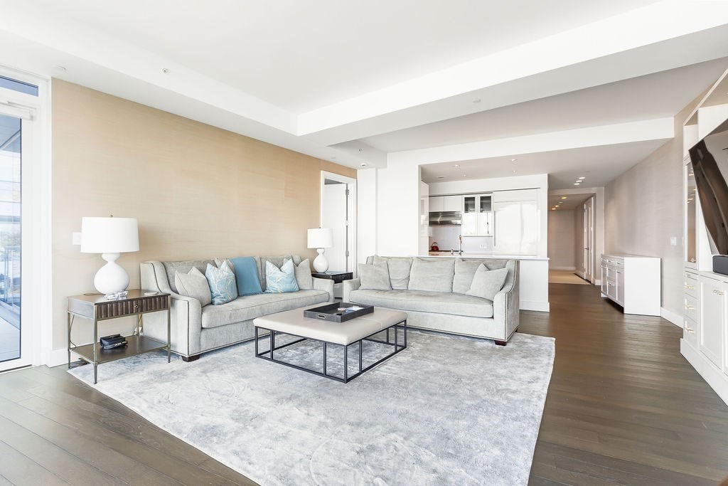 22 Liberty Drive, Unit 2F Boston, MA 02210 - Photo 6 of 28 a living room with furniture and a wooden floor
