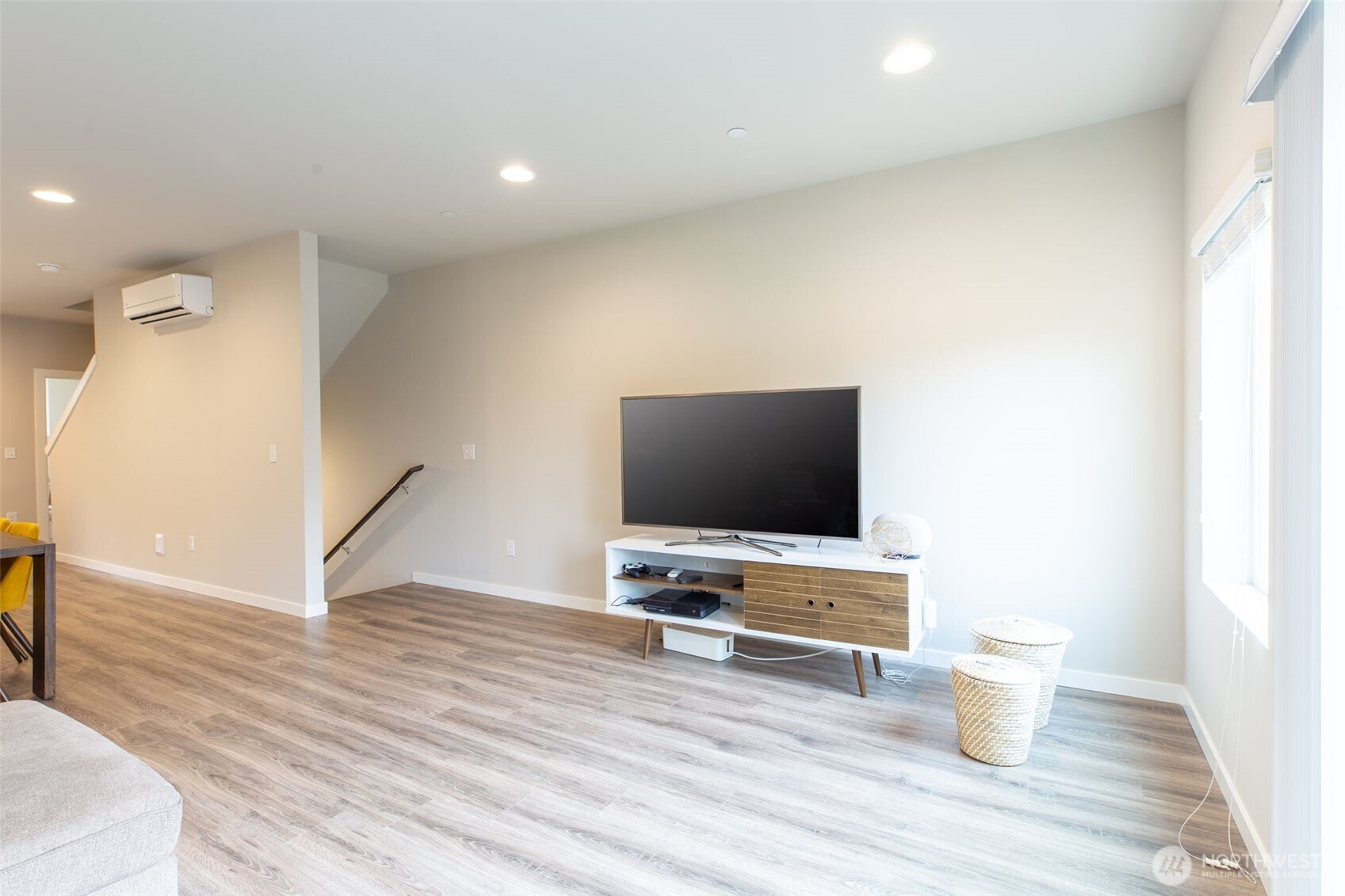 15113 40th Avenue West, Unit B2 Lynnwood, WA 98087 - Photo 21 of 36 a view of an empty room with wooden floor and a window
