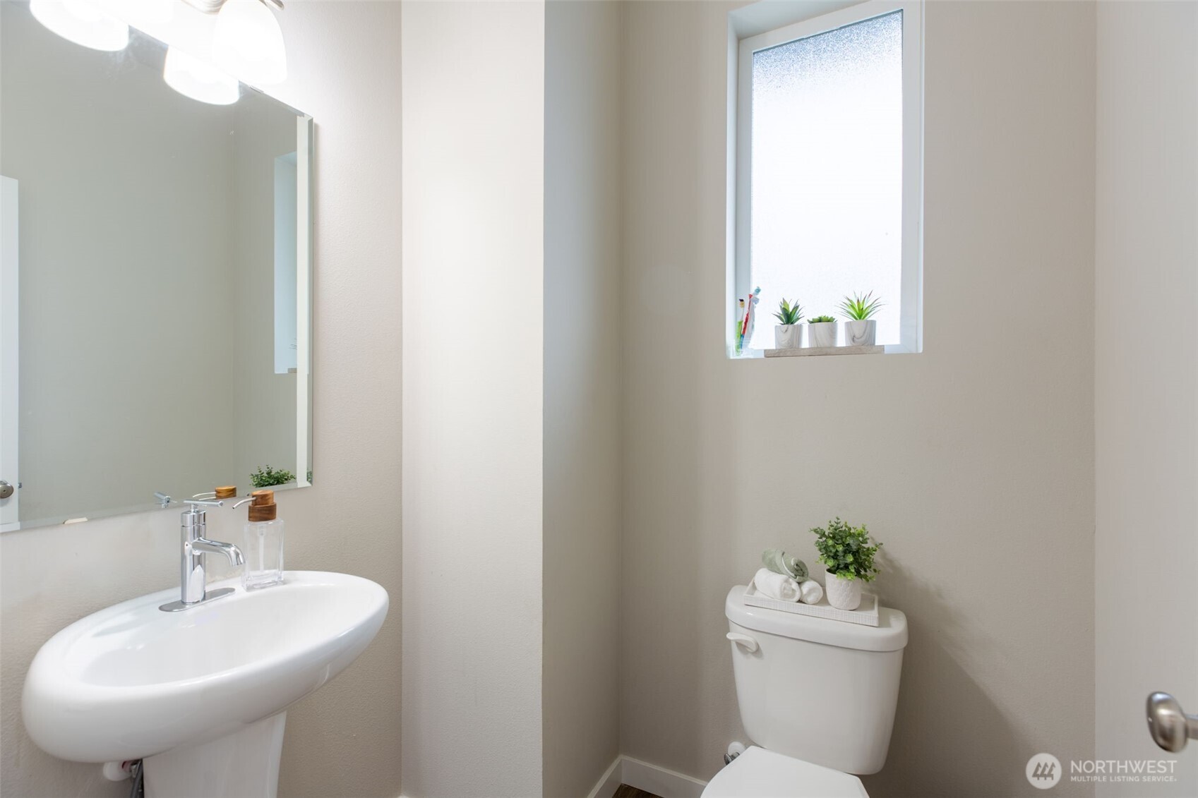 15113 40th Avenue West, Unit B2 Lynnwood, WA 98087 - Photo 5 of 36 a bathroom with a sink mirror and toilet