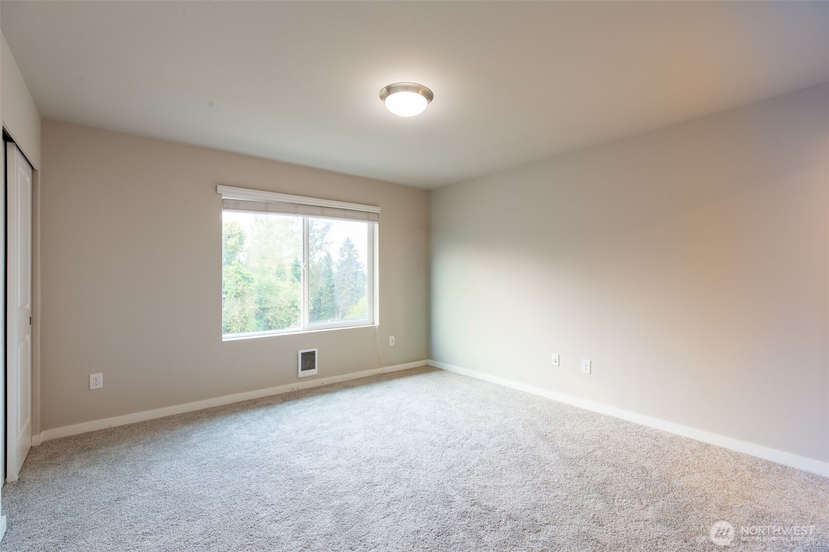 15113 40th Avenue West, Unit B2 Lynnwood, WA 98087 - Photo 6 of 36 a view of an empty room with a window