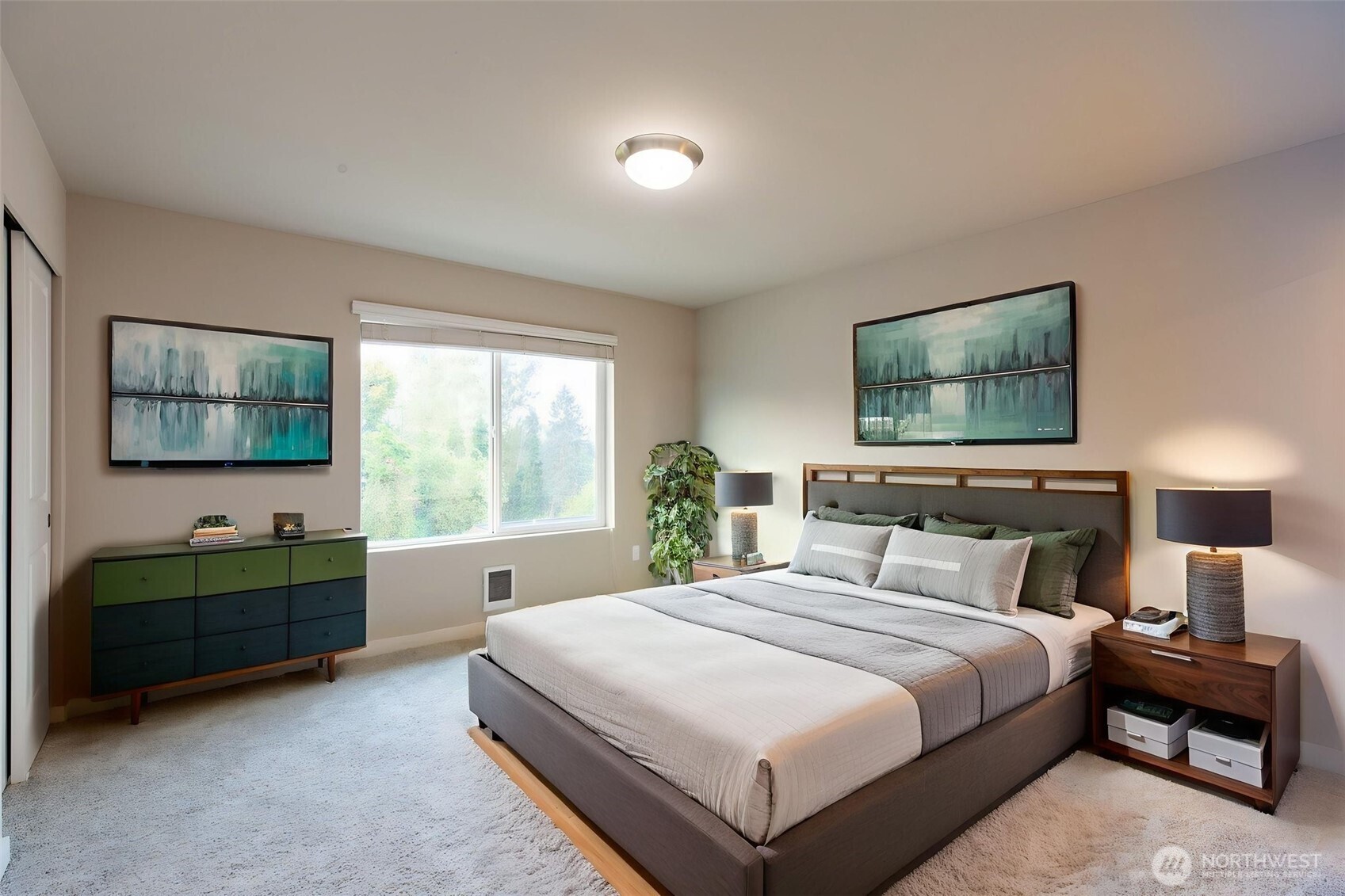 15113 40th Avenue West, Unit B2 Lynnwood, WA 98087 - Photo 7 of 36 a bedroom with a bed and a flat tv screen on dresser