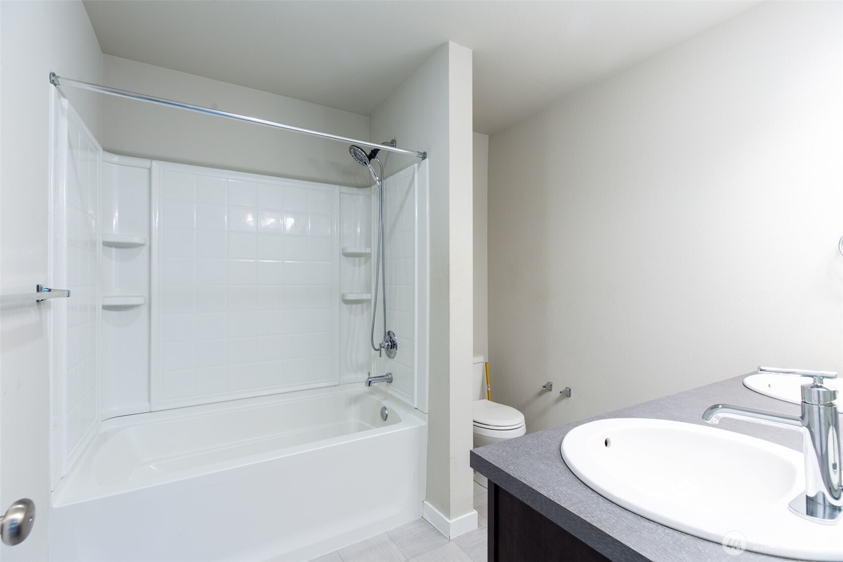 15113 40th Avenue West, Unit B2 Lynnwood, WA 98087 - Photo 9 of 36 a bathroom with a sink a toilet and a bathtub