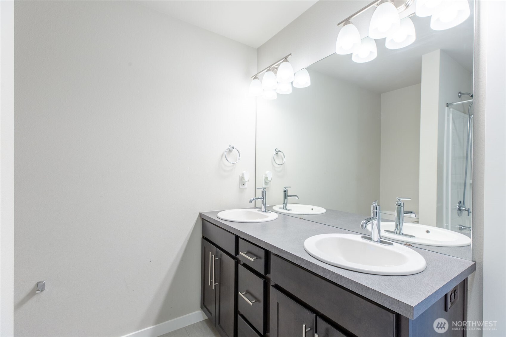 15113 40th Avenue West, Unit B2 Lynnwood, WA 98087 - Photo 10 of 36 a bathroom with a sink and a mirror